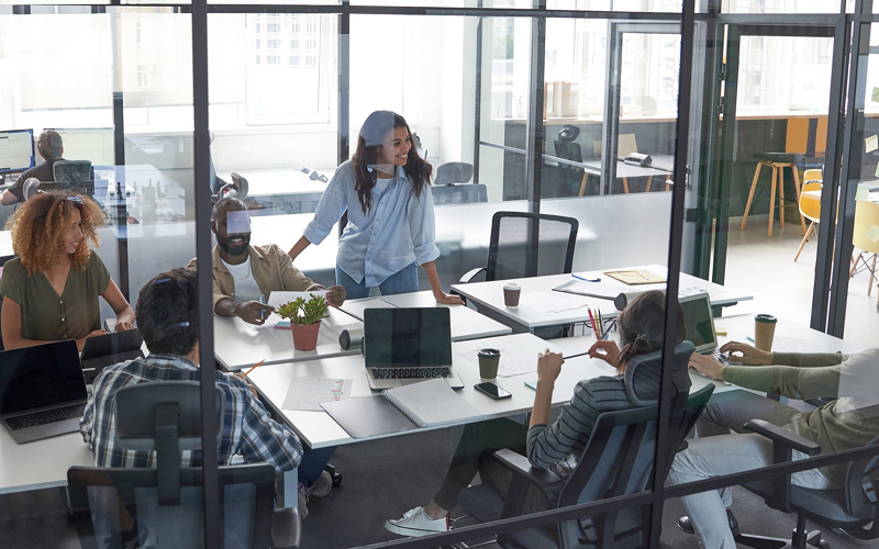 Collaborative team meeting in an open office.