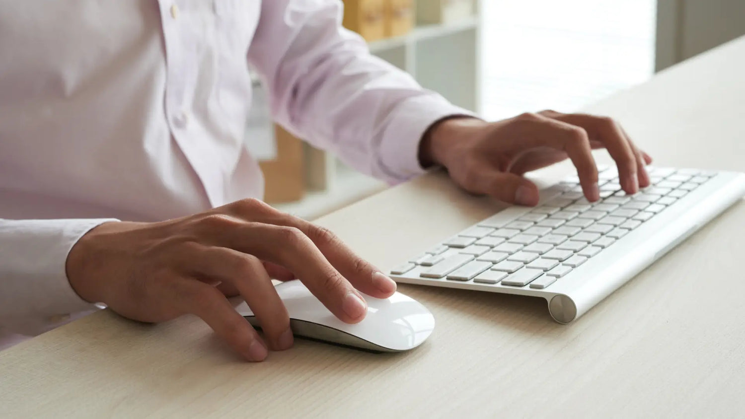 man using ergonomic mouse and keyboard